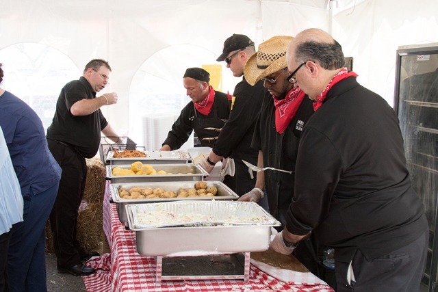 Men Serving Food at Lunch